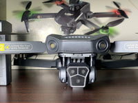 P1 MAX GPS Camera Drone With Dual Battery Triple Camera Foldable Brushless Motors Drone with 50X Zooming Obstacle Avoidance Electric Adjustable Camera Headless Mode Flow Of lights One Key Landing 360° Rotation High Quality Camera Drone With Unique Design